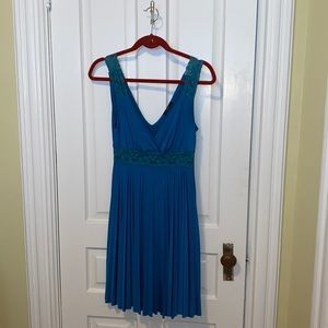 Beautiful turquoise dress with pleats and lace